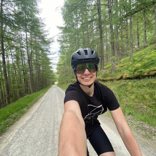 Selfie of female on bike on open road