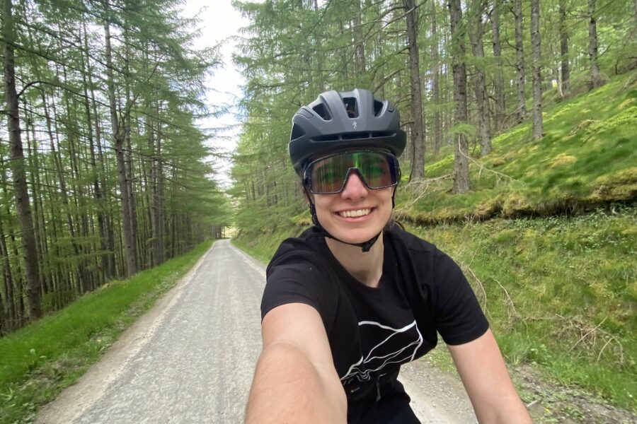 Selfie of female on bike on open road