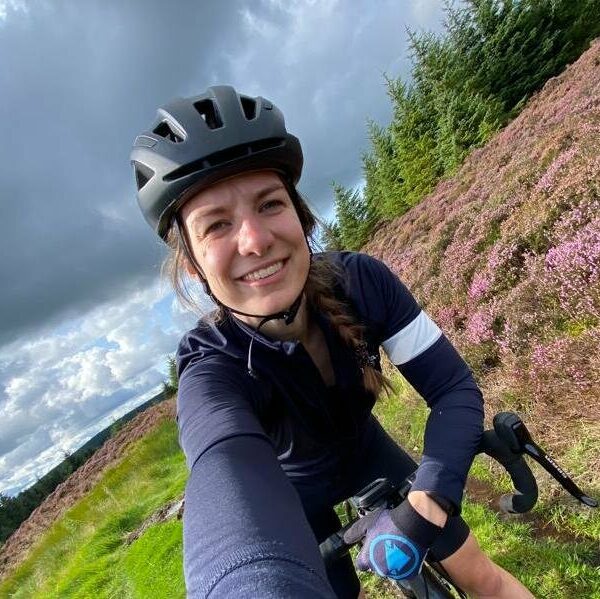 Female cyclist in the hills